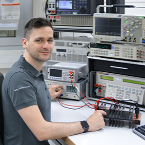 A Testo employee during calibration in the electrical laboratory.
