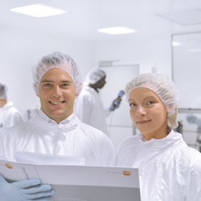 Two employees in the clean room.
