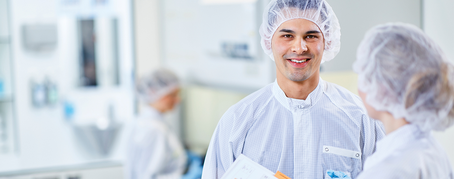 Employees in cleanroom clothing in a medical technology company