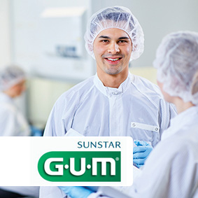 Employees in cleanroom clothing Employees in cleanroom clothing in a medical technology company