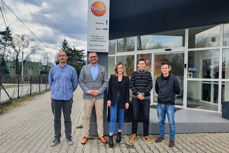 Our new team members from the Poland site stand in front of the Testo building