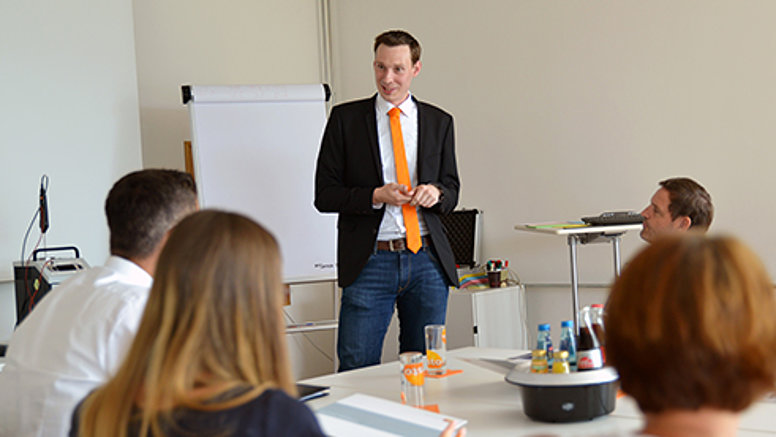 Testo offers exclusive employee benefits for your personal development. Testo employees at a training seminar.